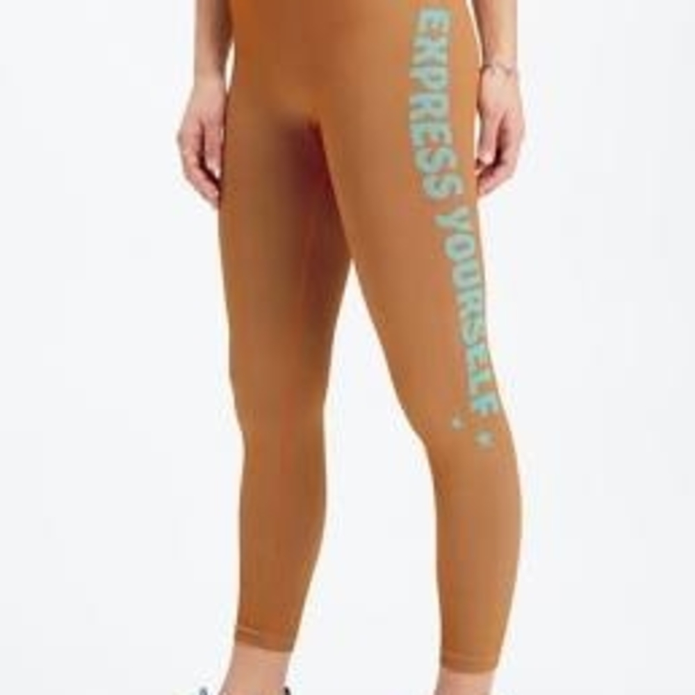 Fabletics Orange Express Yourself Leggings with beautiful turquoise logos.